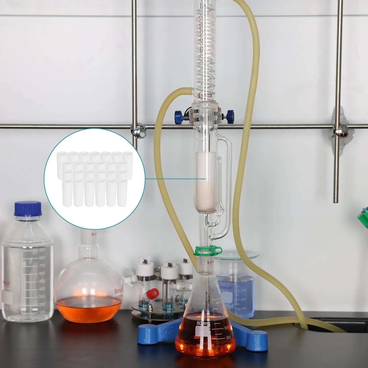 A laboratory setup showing a Soxhlet extractor in operation with a thimble inside the glass chamber